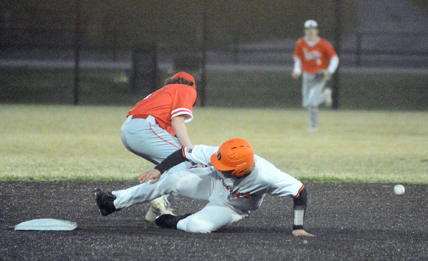 Eli Wilson (middle) slides safely into second base for Tyler Ahring’s Owensville Dutchmen during preseason Four Rivers Conference (FRC) Tournament action against St. James at OHS Field.